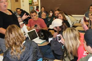 Lily stops to work on a students comptuer 374989_10151605436314169_1141479475_n